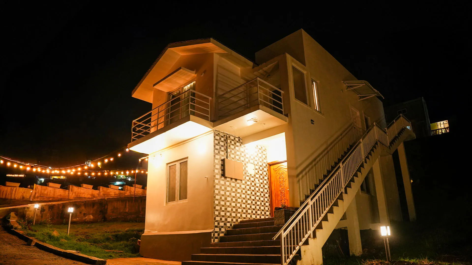 Hammock between trees beside a nature cottage at the best stays in Ooty.