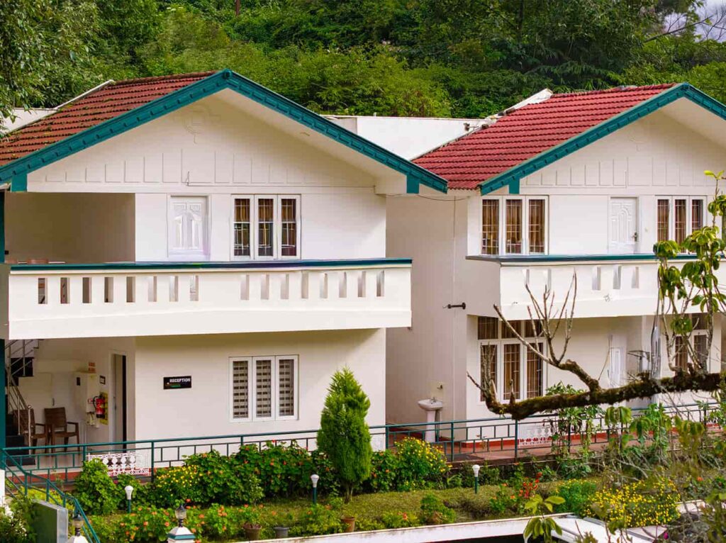 Misty morning view from a hilltop cottage in best stays in Ooty.