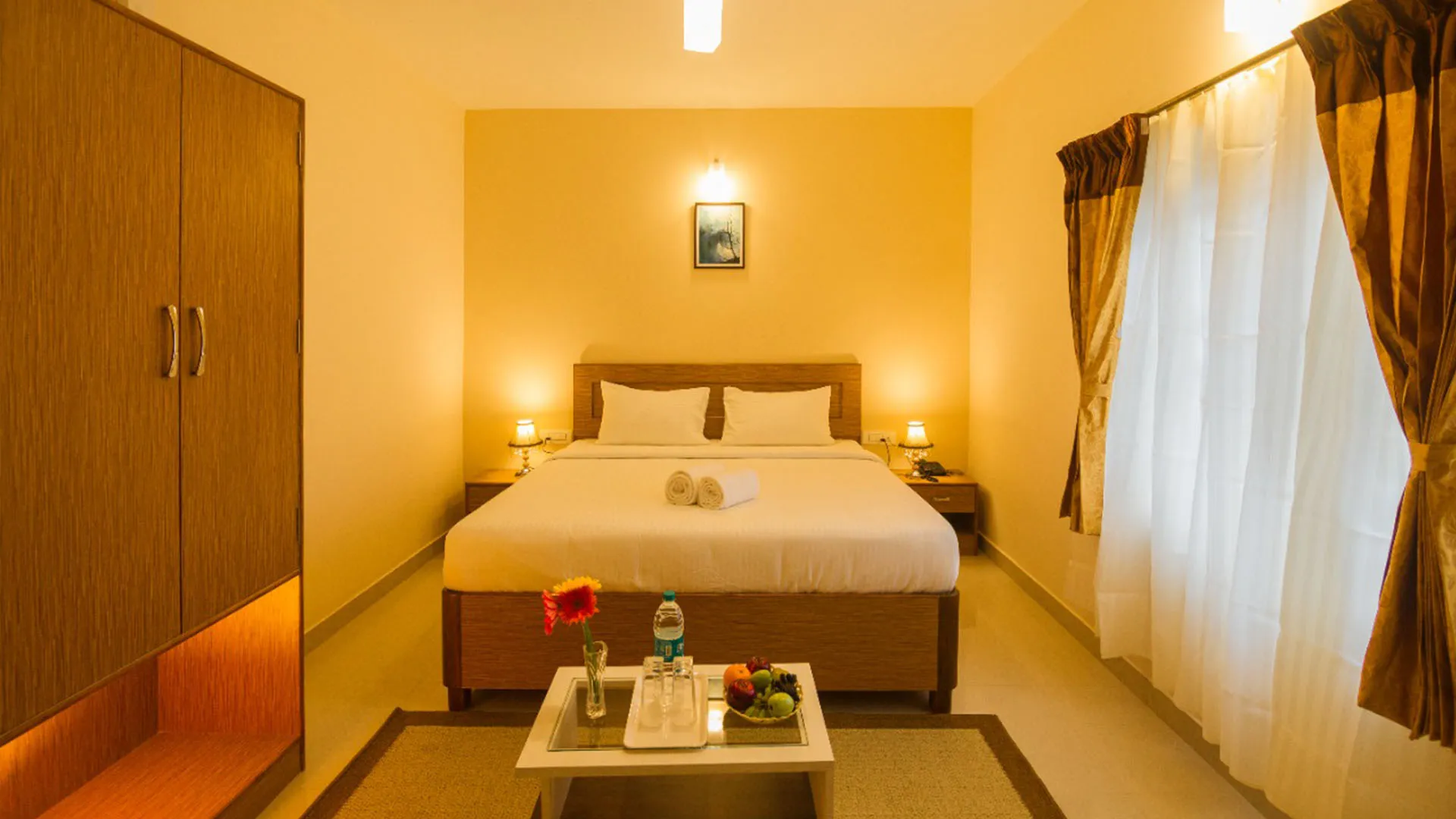 Sunset view from a nature cottage balcony at the best stays in Ooty.